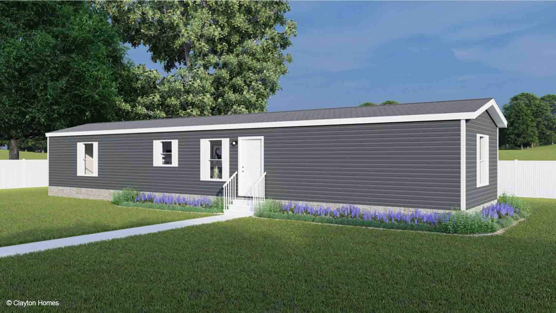 Single-story, gray manufactured home with white trim, small porch, and garden set on a grassy lawn, see its inviting charm in this manufactured home rendering.